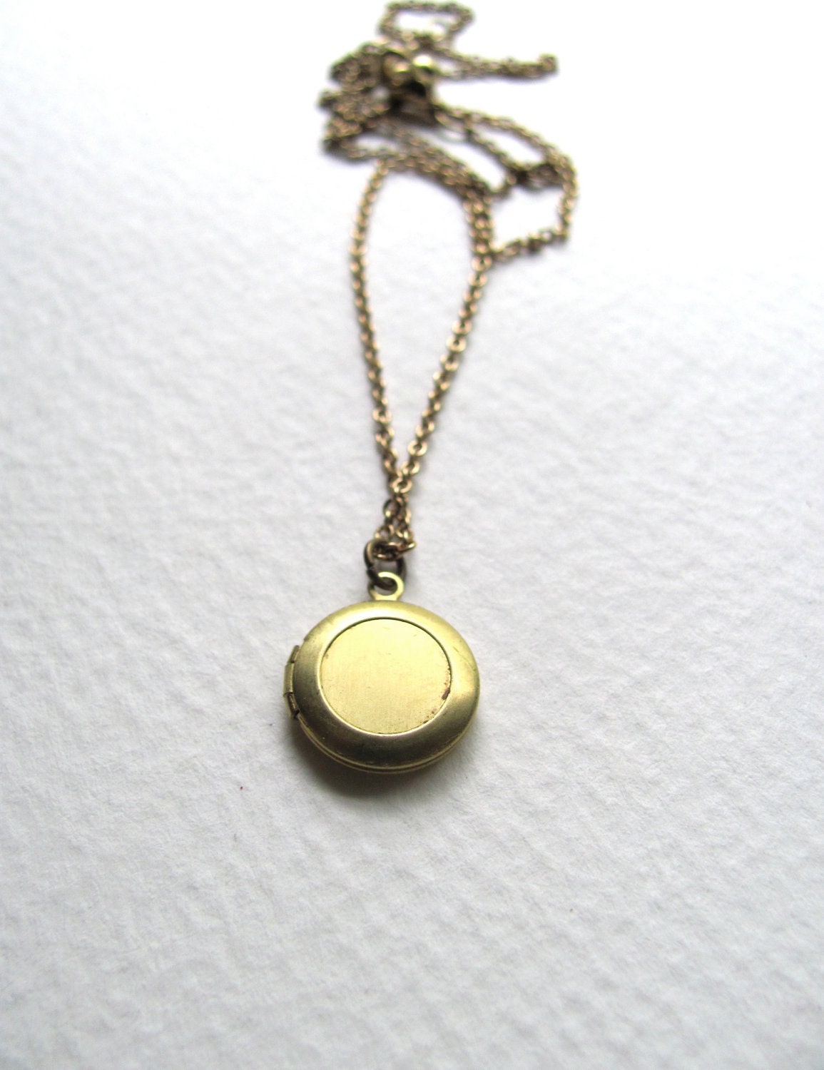 Gold tone raw brass round vintage locket on delicate 14k gold plated chain, upcycled vintage piece