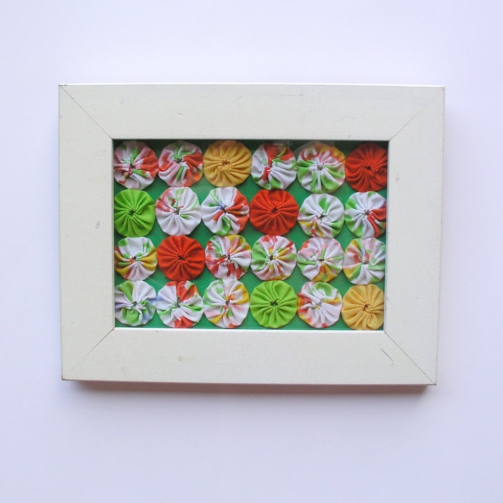 YoYo Quilt Framed orange green yellow