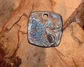 Raku fired square pendant rounded edges  copper,silver and,  blue odd31