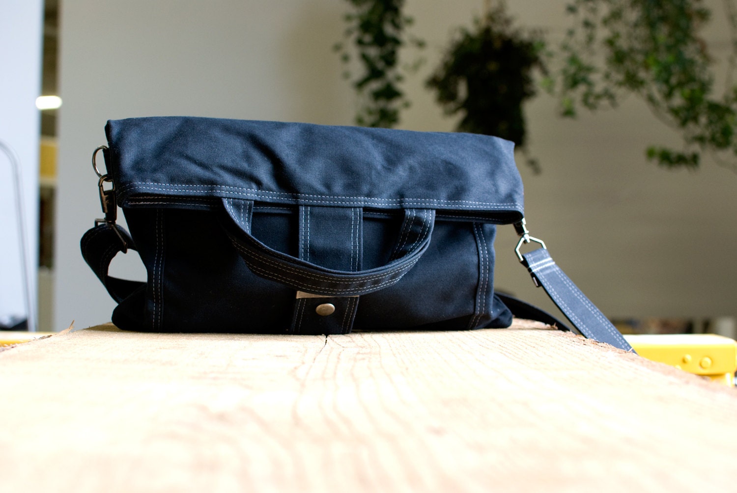 The Paperback in black waxed canvas