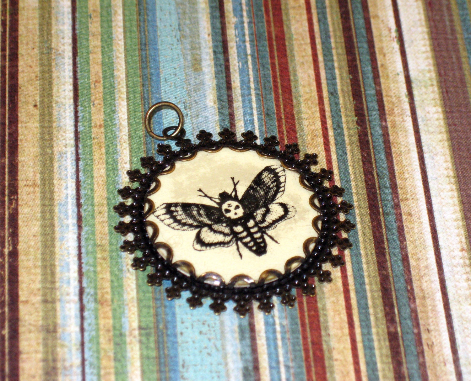 Deaths Head moth brass filigree charm skull design