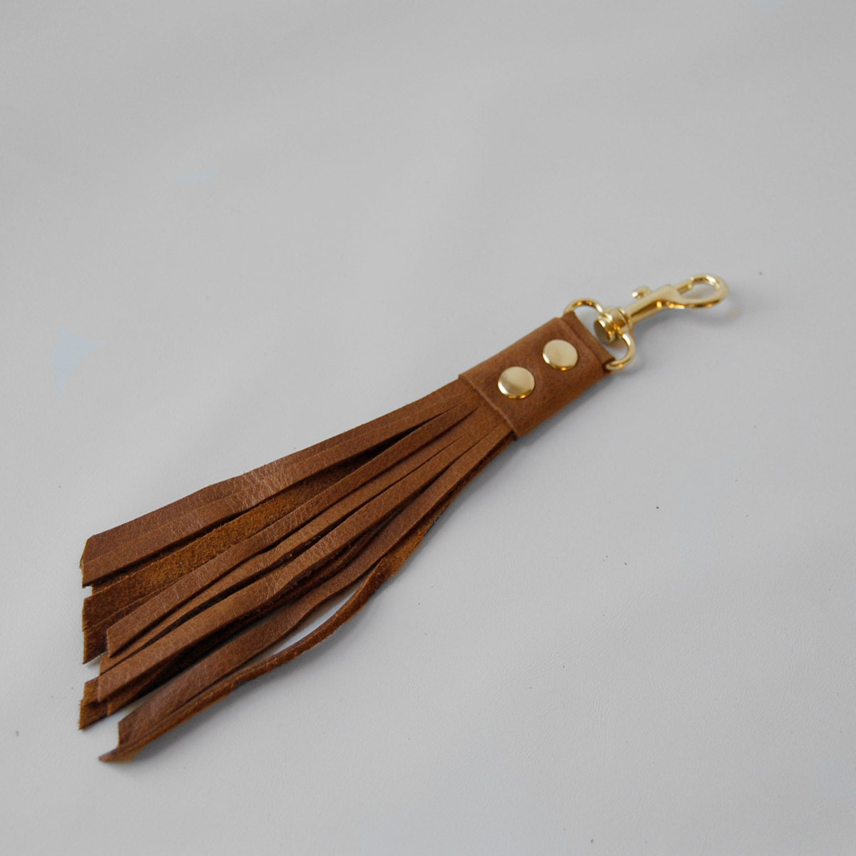 clip on tassel in whiskey/gold hardware