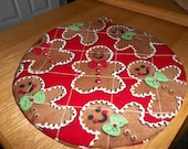Gingerbread Men Christmas Round Hot Pad or Pot Holder Cotton Fabric 9 Inches on Red Background