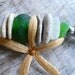 A MAGIC EYE...a magnifying glass adorned with sea treasures,sea glass and stones,African glass