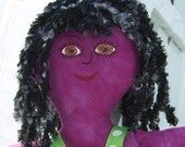 Magenta cloth doll with black hair and brown eyes