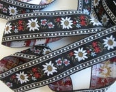 3 yards EDELWEISS & ENZIAN wide Jacquard trim. White, red, light blue, brown, on black.  1 1/4 inch wide. 944(3)-A