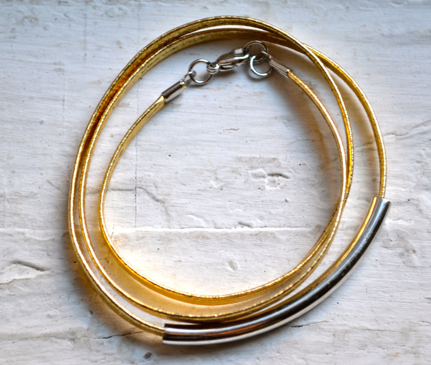 metallic gold skinny leather triple wrap bracelet with long silver tube