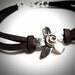 Sterling Spiral Fleur on Leather bracelet