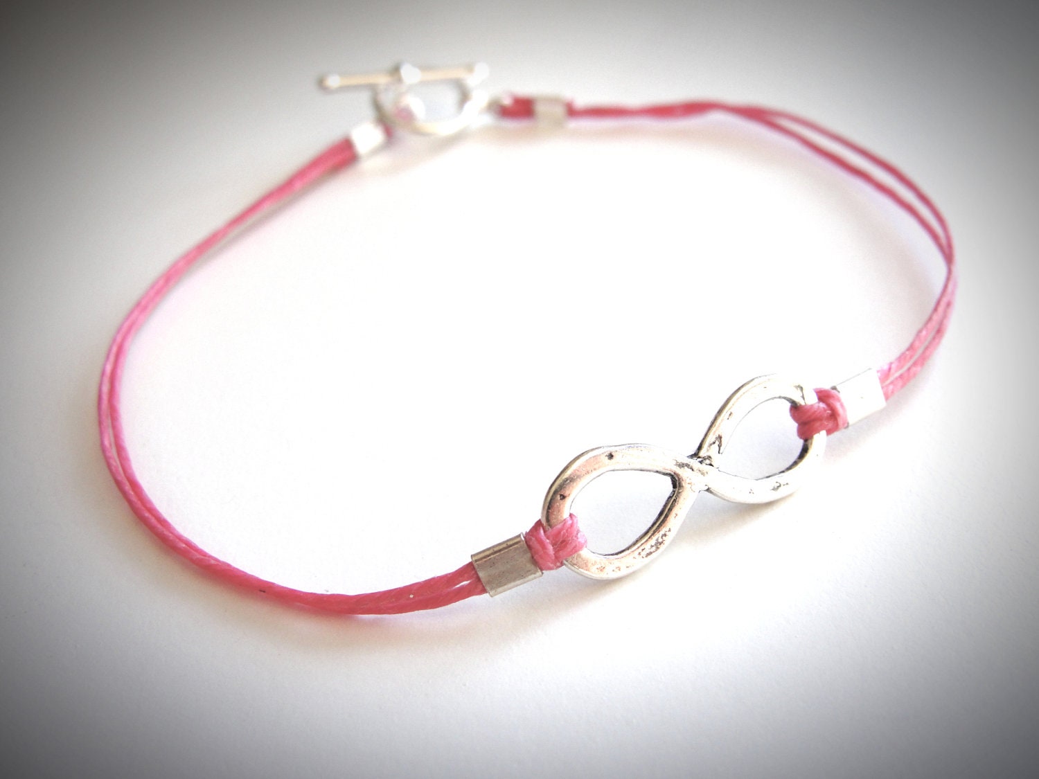 Infinity Me bracelet on linen