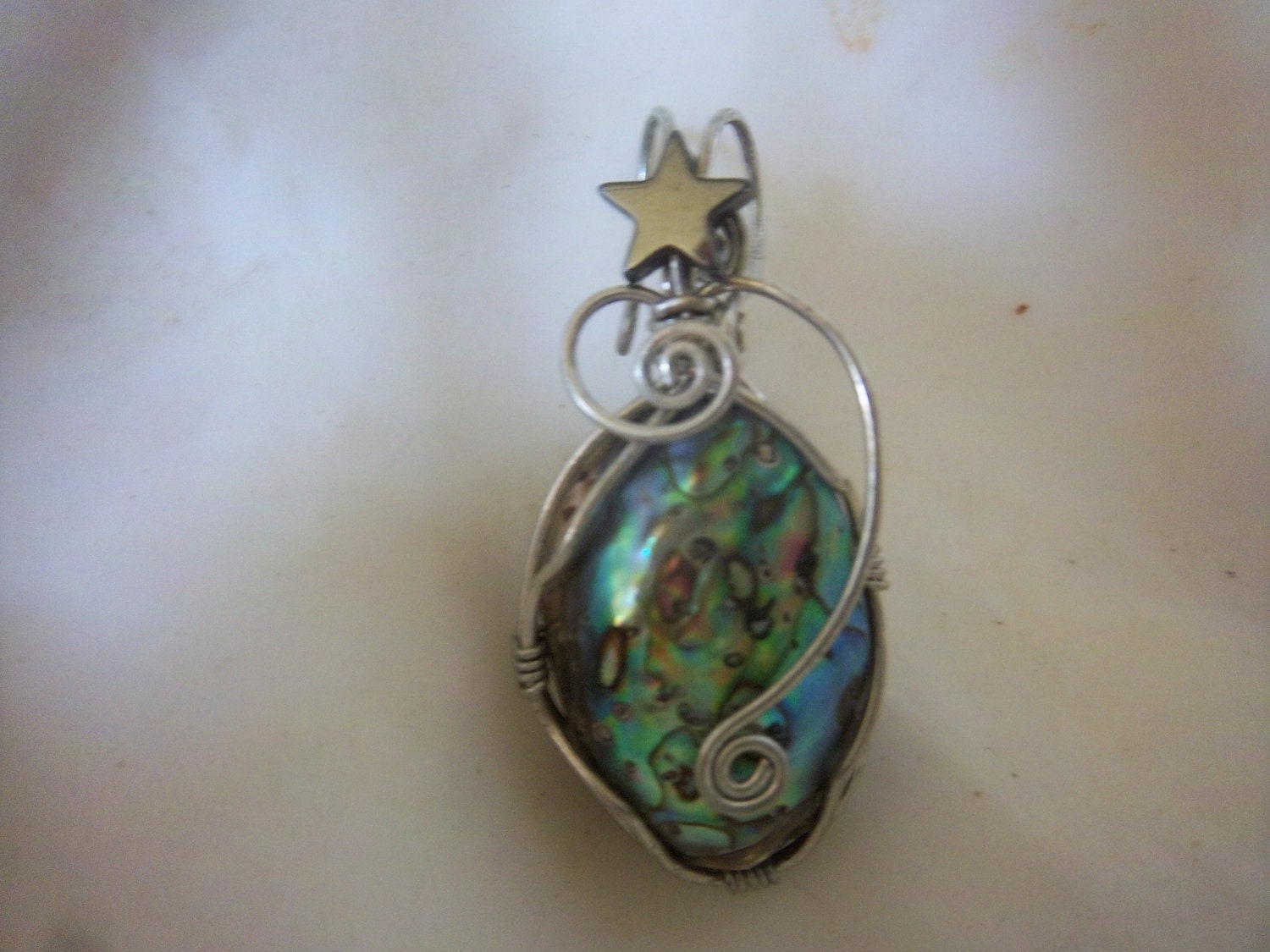 Silver  Wire wrapped Paua Abalone shell pendant with star