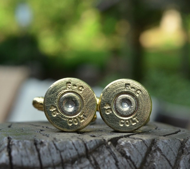 Bullet cufflinks fashioned from repurposed gold/brass Federal Cartridge .45 Long Colt shell casings