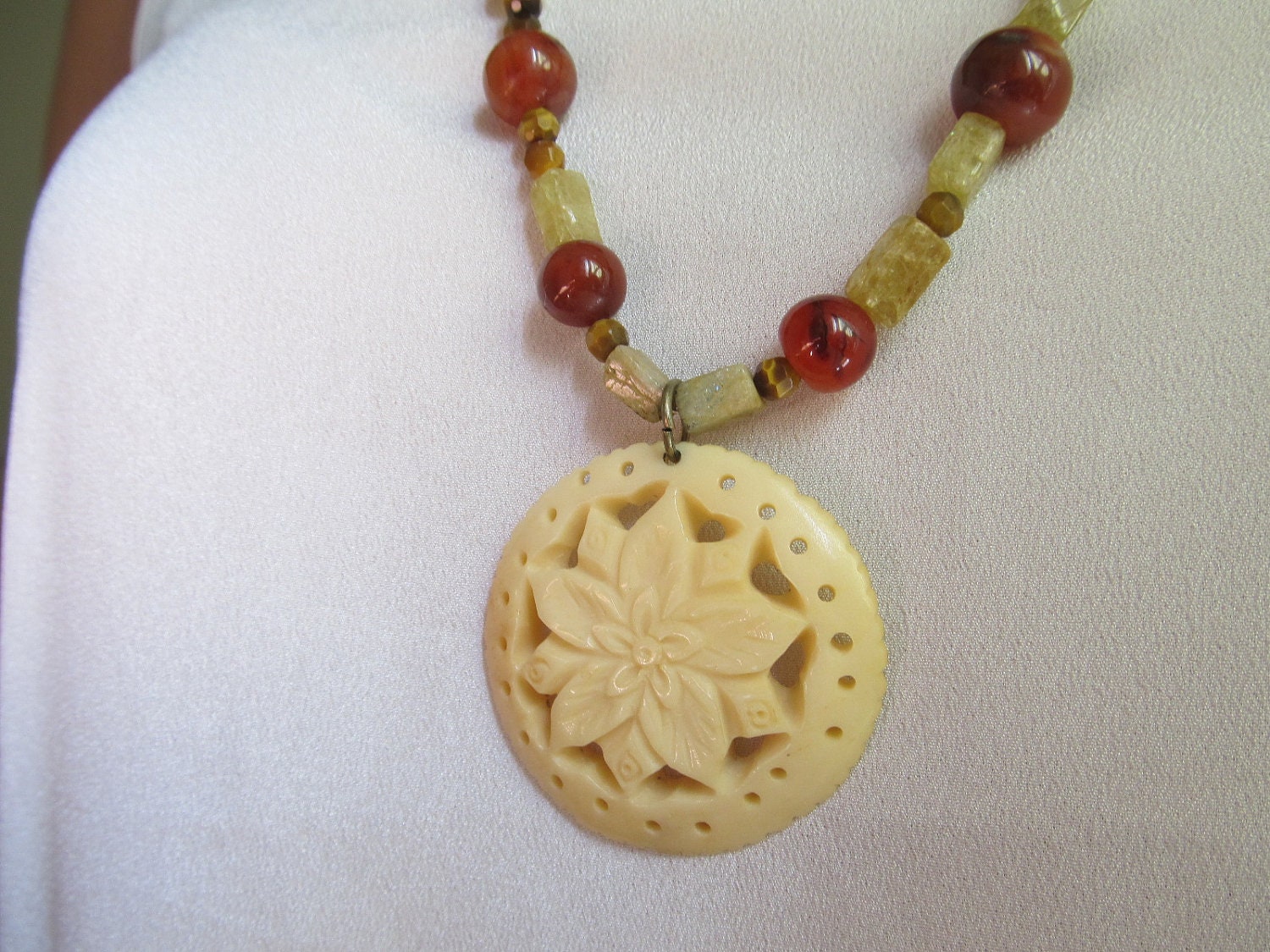 Ivory flower pendant and beaded necklace