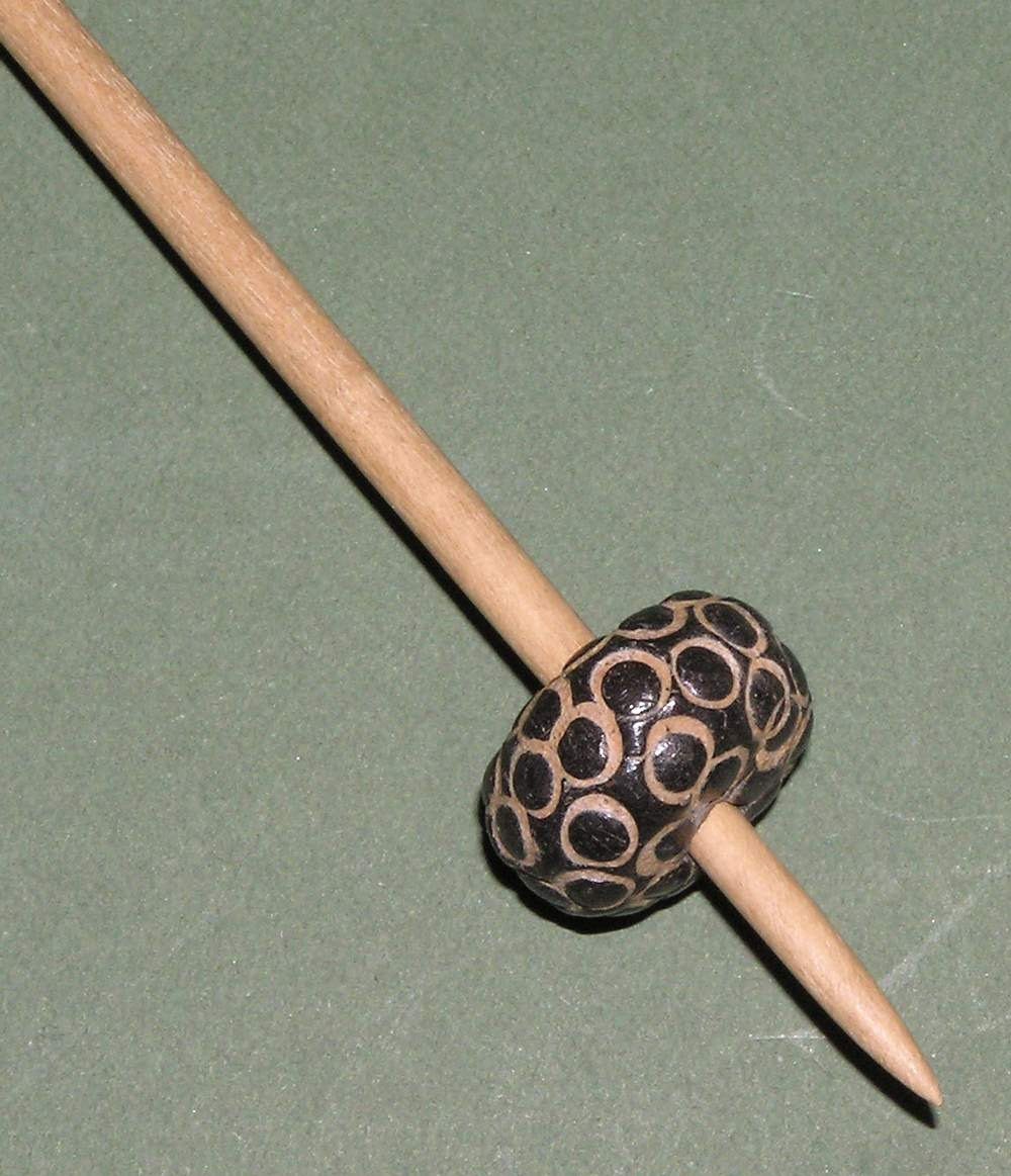 African bead-whorl support spindle