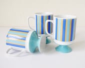 Striped pedestal mugs