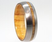 Olive Wood Ring with an inner Wood sleeve and Wood Pinstripe