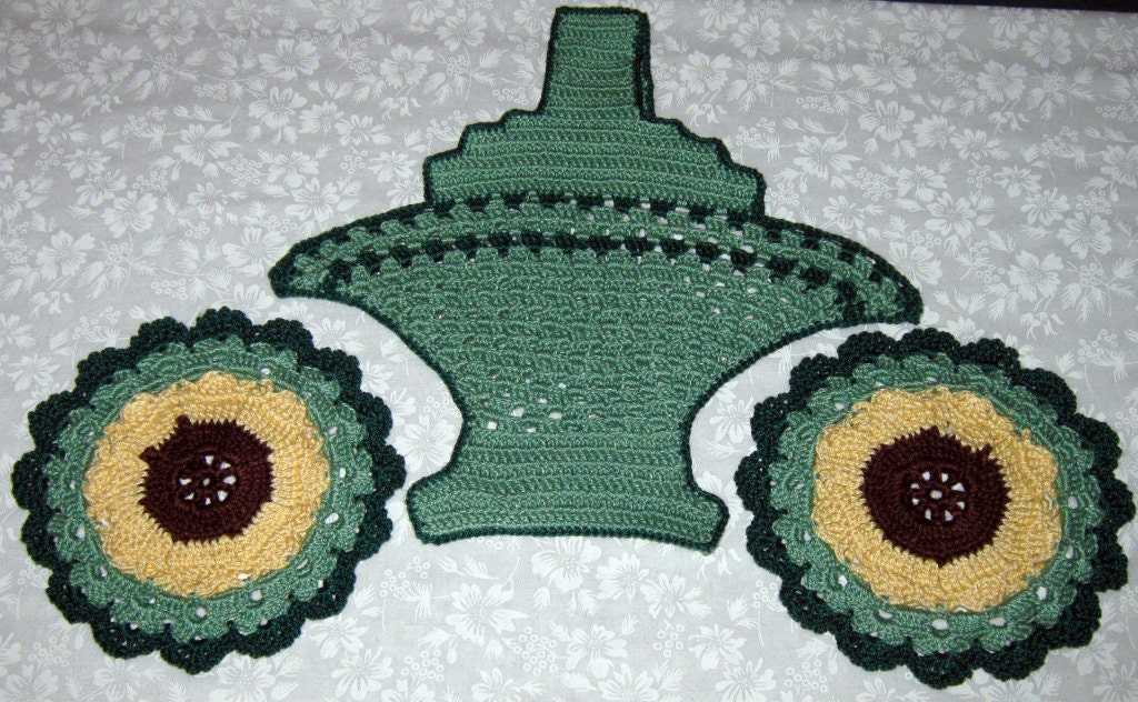 Basket of Potholders or trivets, Two round and one basket shape.