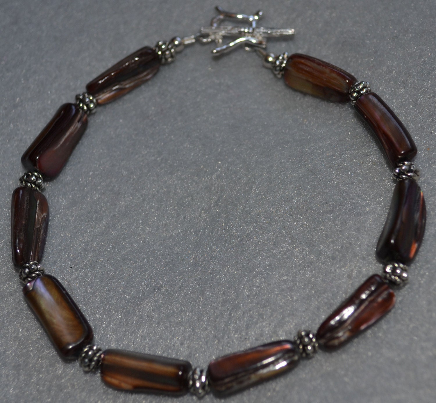 Awesome Abalone Bracelet with Brown Tinted Abalone Accented with Bali silver beads and sterling silver toggle clasp
