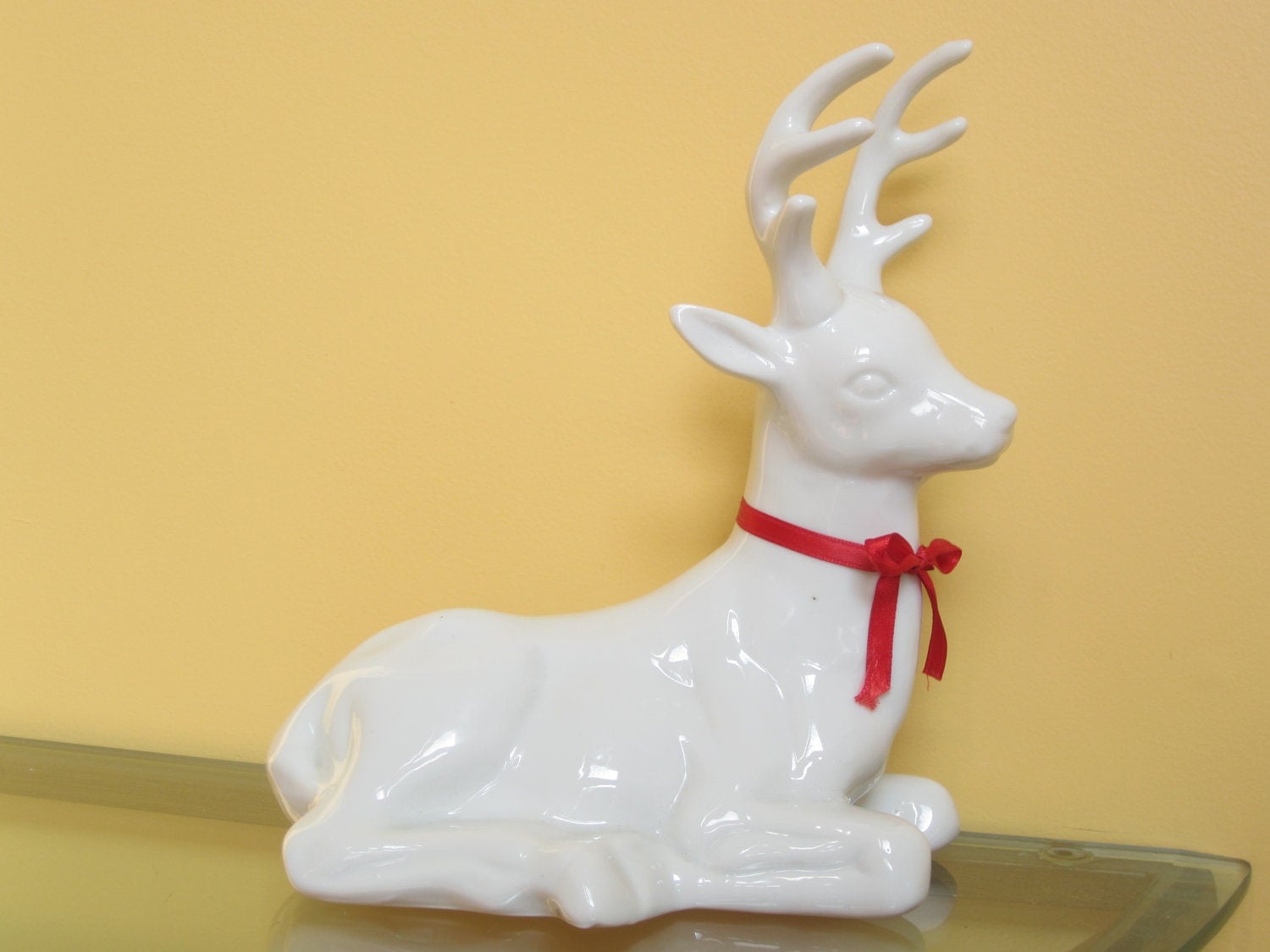 white and gold ceramic reindeer