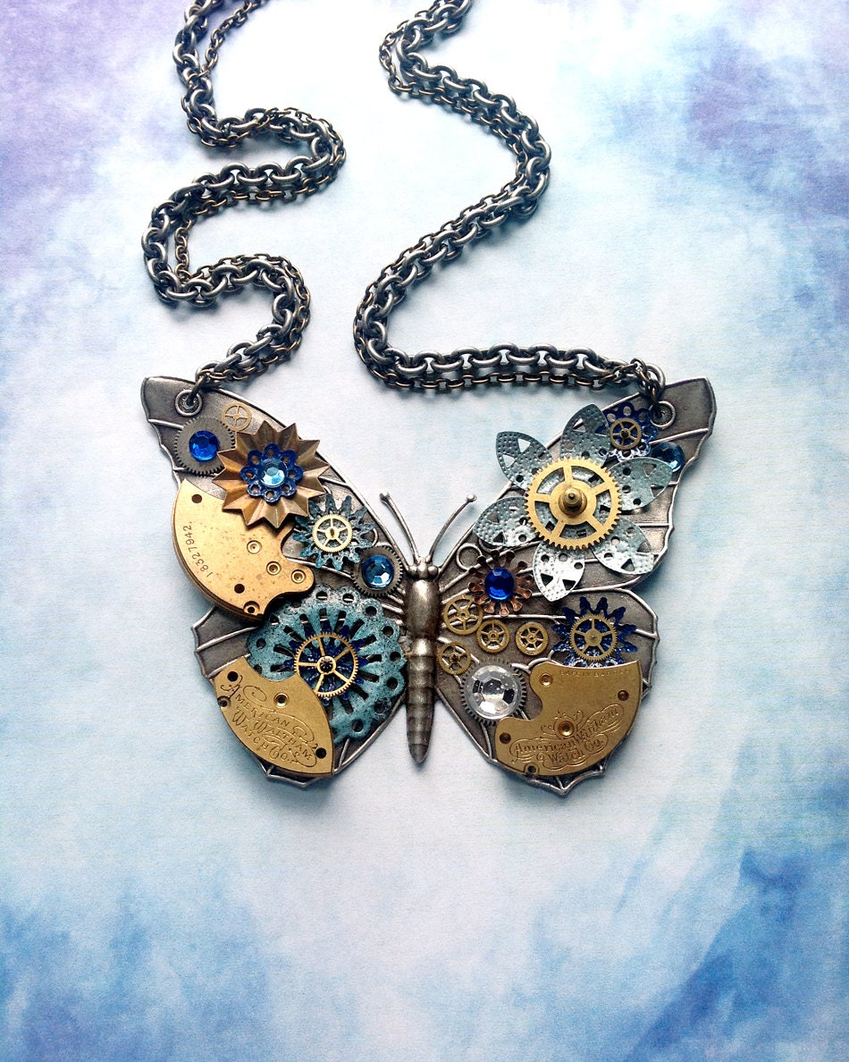 Steampunk Butterfly Necklace - Silver Butterfly with Watch Gears Brass Flowers and Jewels in Royal and Light Blue
