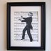 Sheet music print, moustached and blindfolded dapper man