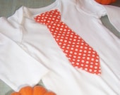 Great orange Thanksgiving tie. Order NOW. Baby onesie with tie, orange with white dots.