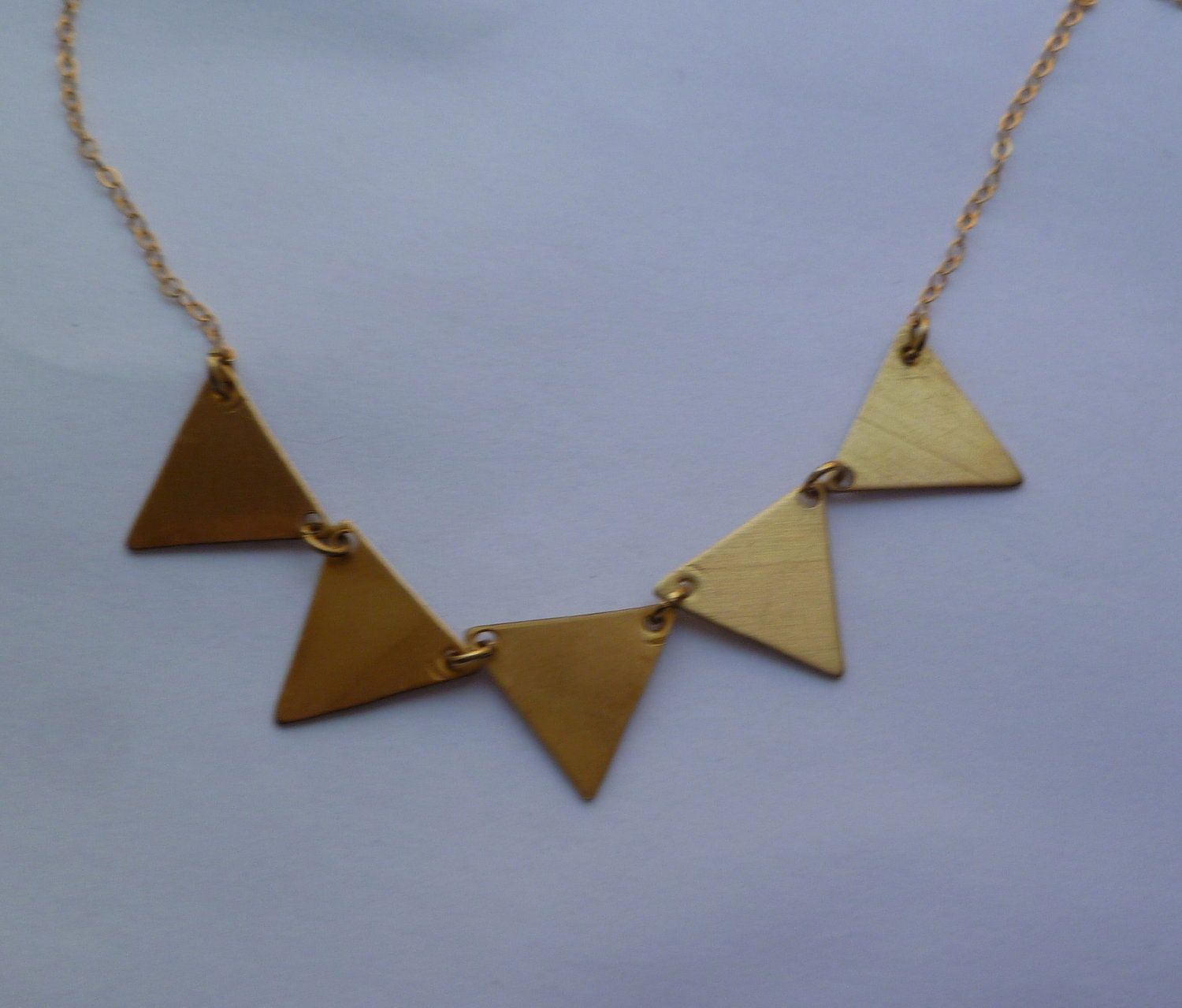 Bunting necklace in gold and brass