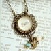 Faith.  Antique Brass Inspiration Charm Necklace.  Turquoise and cream beaded with bird charm.