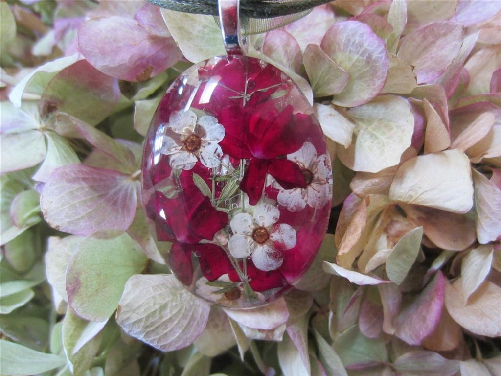 Christmas Ruby  Red  pressed Verbena and Linen Bridal Spirea behind 1.5 handcut glass Oval.