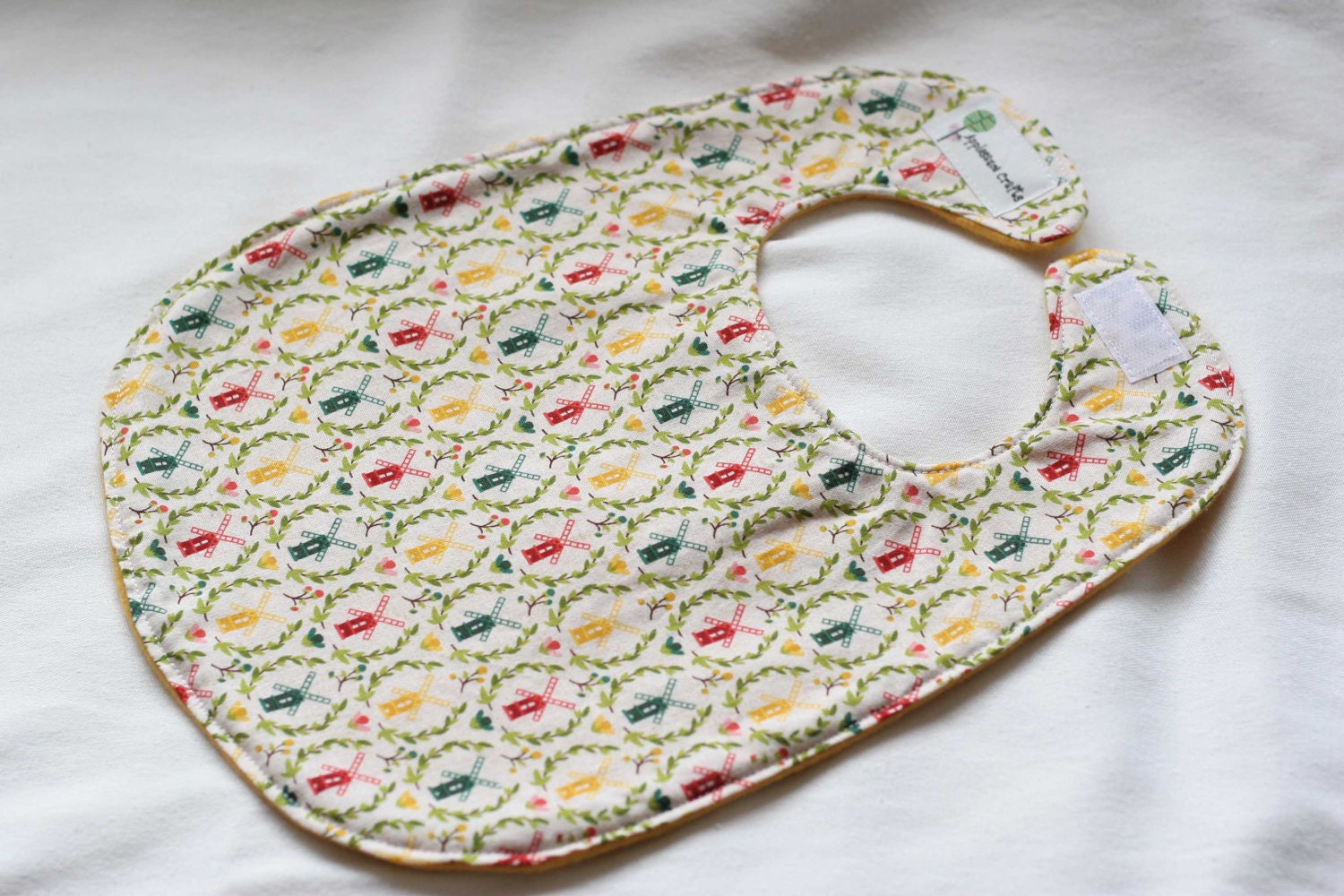 Folksy Dutch Windmill Bib with Golden Yellow Fleece Backing