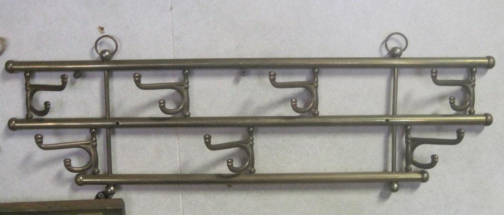 Brass folding hook wall rack. with 7 hooks 22 inches long