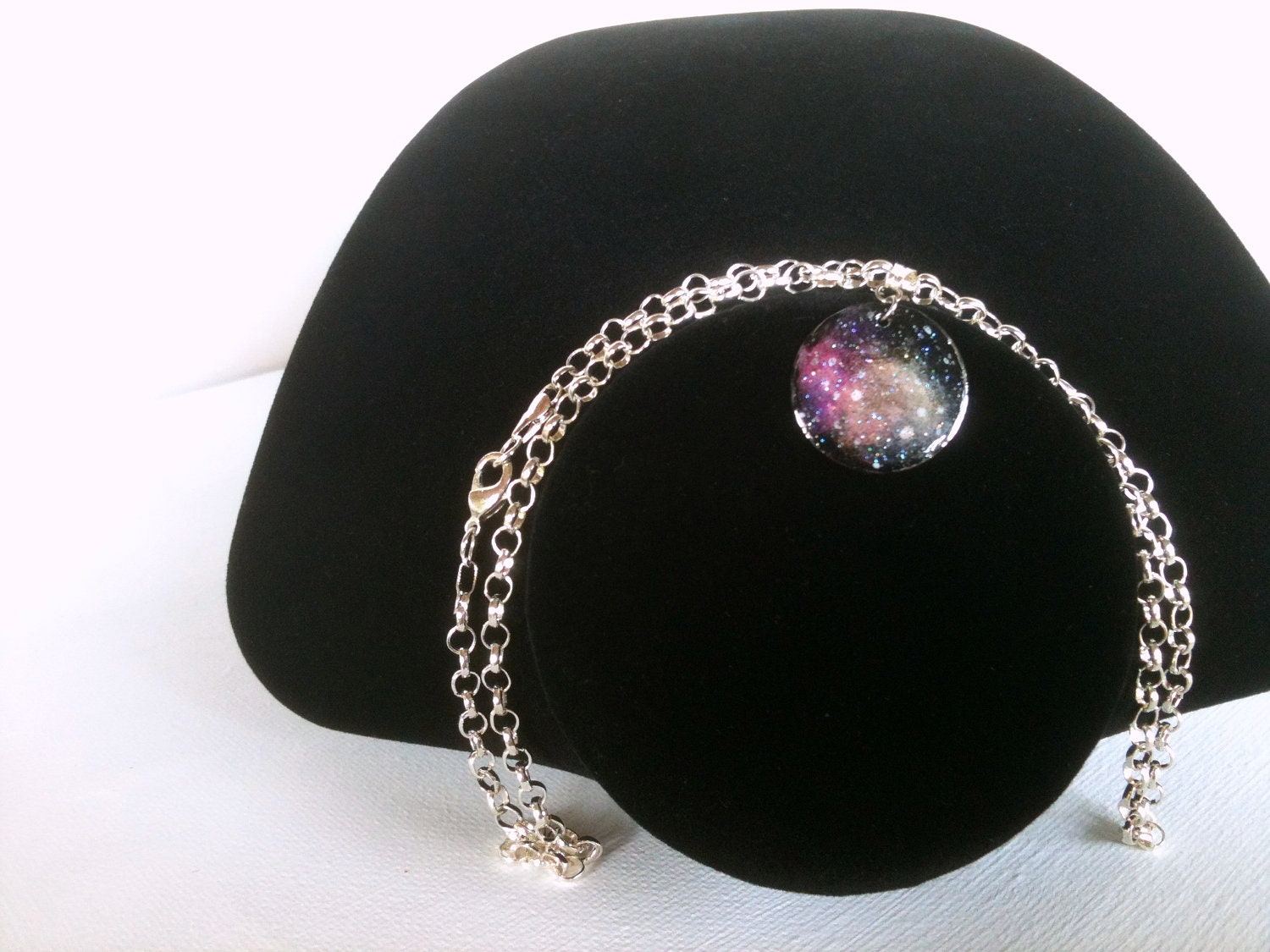 Stargazer Nebula Necklace Hand Painted Pendant in Fuschia, Orange, and Yellow on a Silver Chain by Roots and Wings Designs.