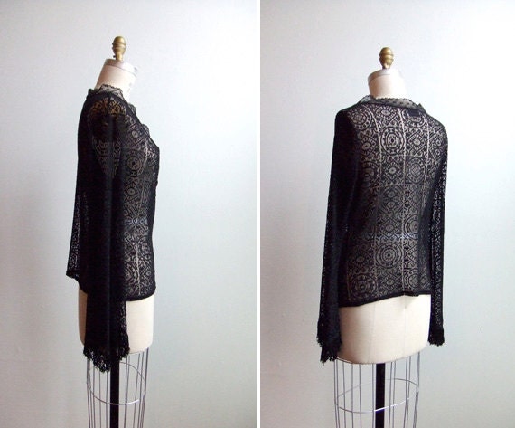 Vintage 1980s designer sheer black lace blouse with fringed detail at cuffs