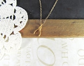 A dream is a WISH your heart makes petite wishbone necklace (gold)