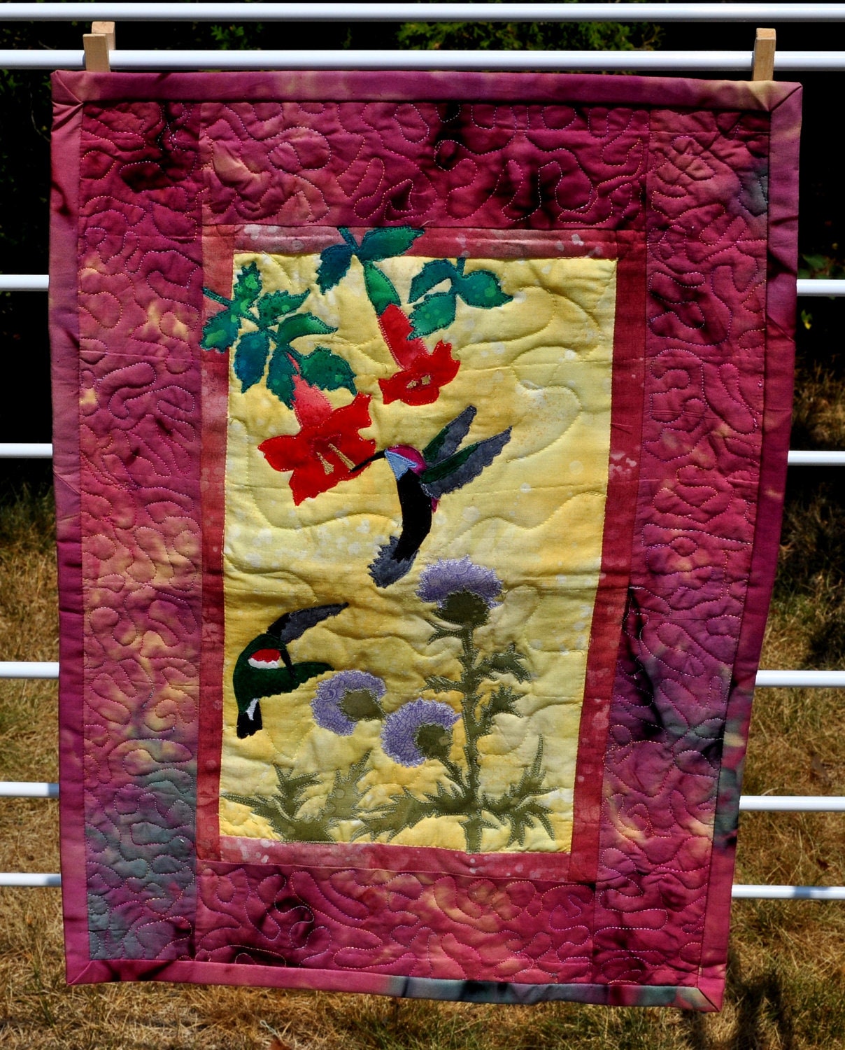 Quilted wall hanging appliqued hummingbirds and flowers