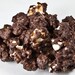 Caramel Corn with Dark Chocolate, Oregon Hazelnut and Toffee Chunks. Wrapped in our biodegradable packaging and perfect for giving