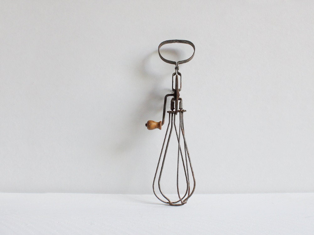 Vintage egg beater, An old rustic French egg beater