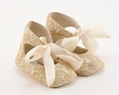 Leather baby shoes  covered with golden lace