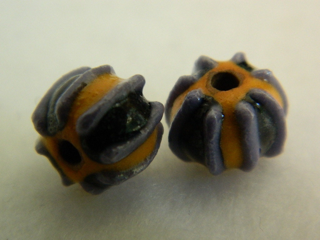 Unique handmade beads in black and purple striped yellow colored porcelain beads, pair