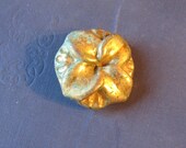 1 Large Gold Orchid Button. 50s.
