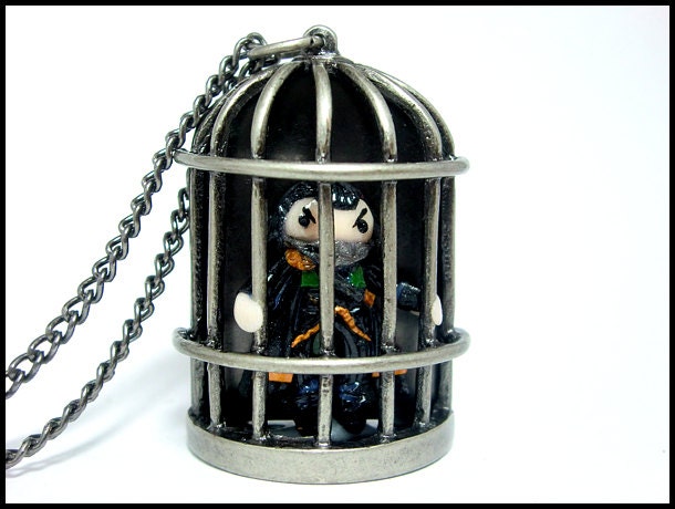 Muzzled Loki in a Cage Necklace