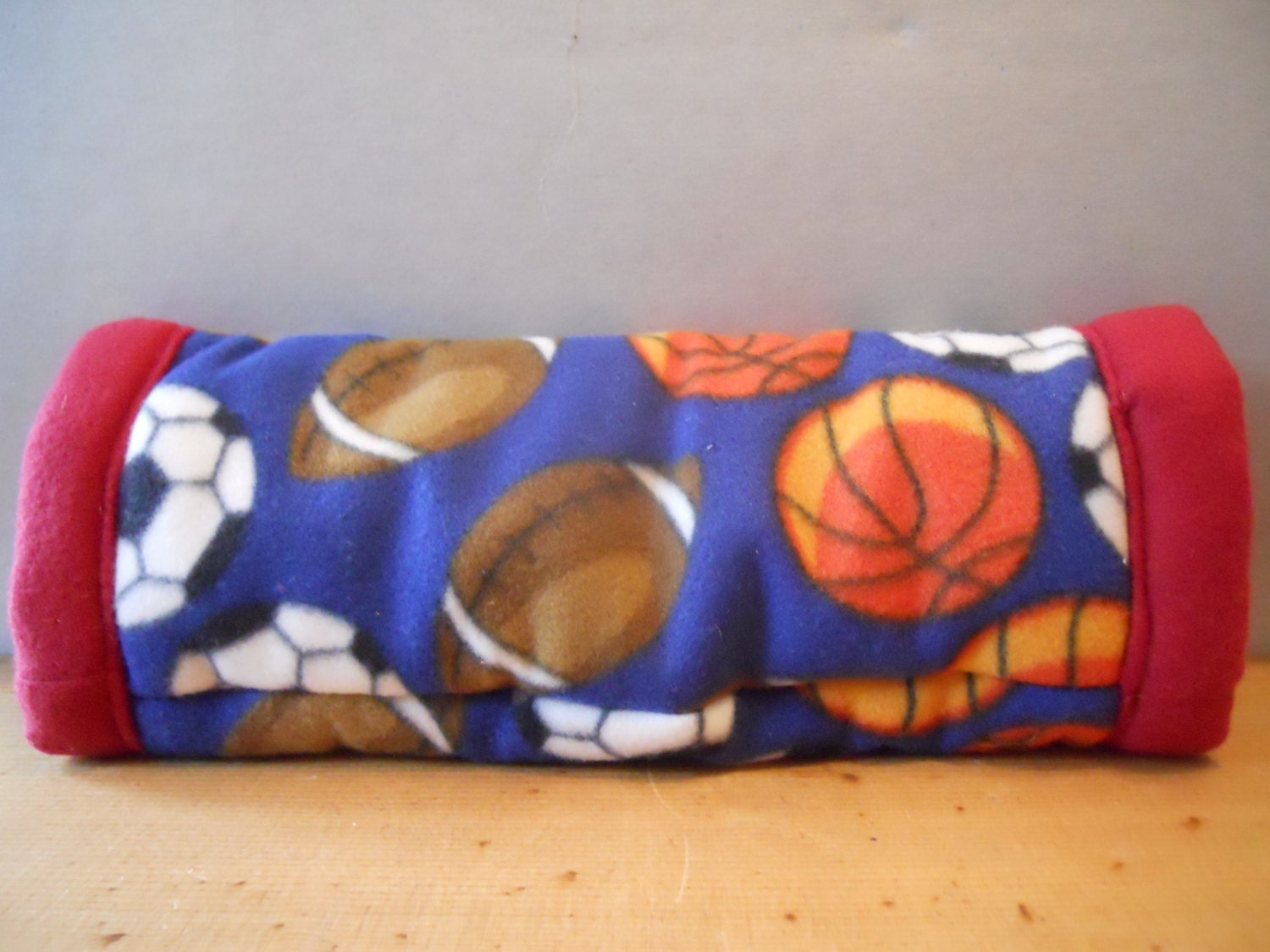 Guinea Pig or Small Pet Fleece Cuddle Tunnel in Navy Sports Pattern with Red Interior
