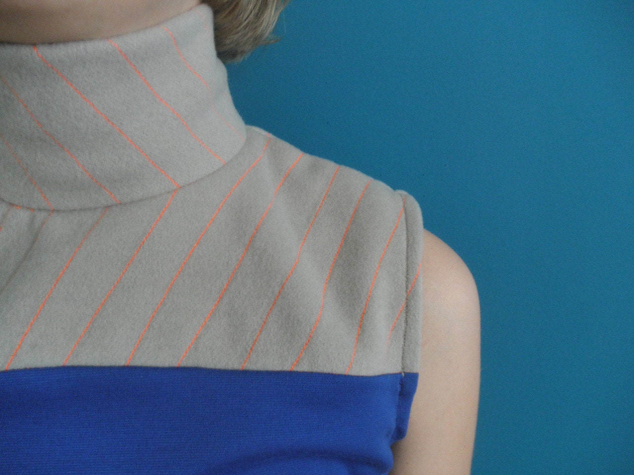 sleeveless colorblock turtleneck cobalt blue/ beige with neon orange stitching