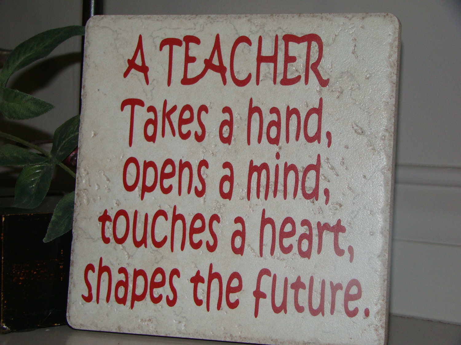 A Teacher Takes a Hand, Opens a mind Teachers Quote on Tile with Vinyl Lettering