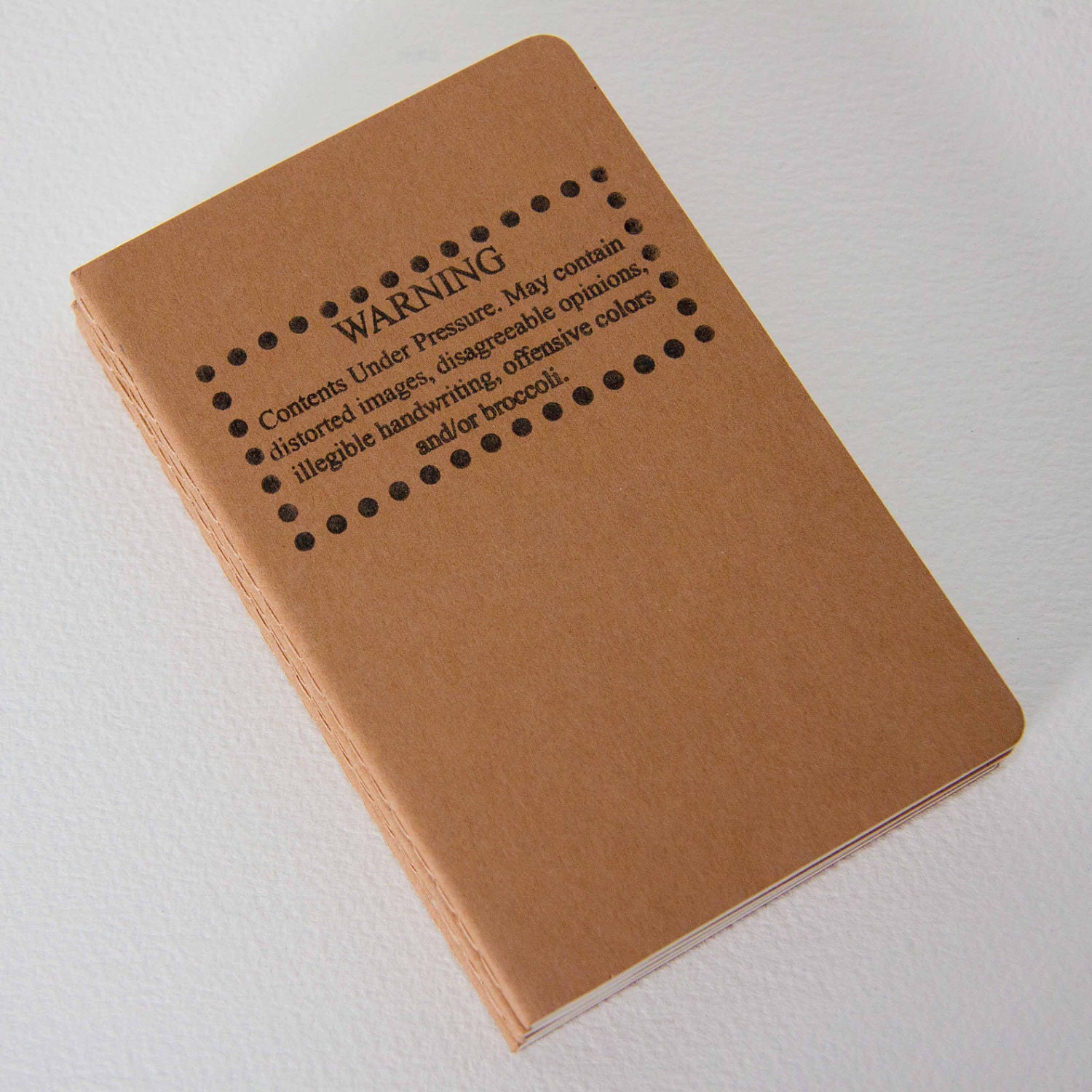 Warning: May contain broccoli - hand stamped moleskine notebook pocket size