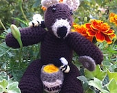 Honey Bear: Knitted toy bear stealing honey.