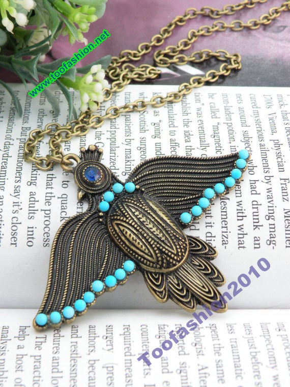 Pretty retro copper woodpecker with blue eye necklace pendant jewelry vintage style