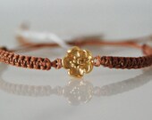 Gold plated sterling silver flower charm bracelet on brown cord