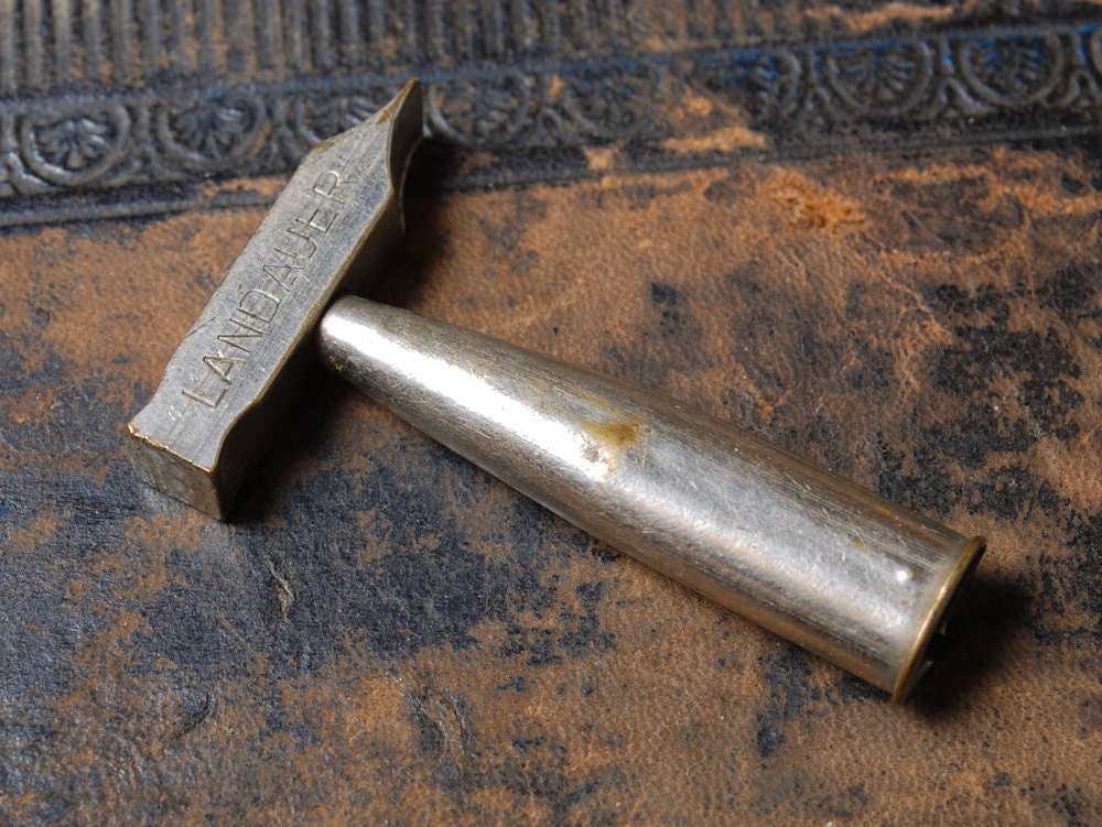 Vintage metal advertising item, hammer Cognac Landauer
