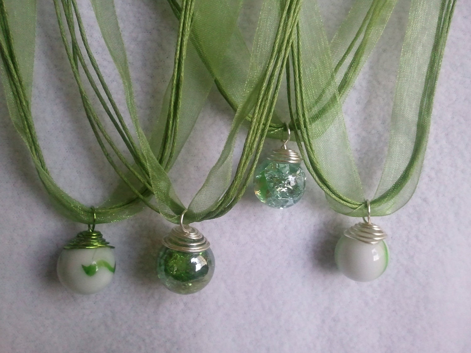 Fried Glass crackled marbles and uncrackled swirled green Marble on a green ribbon Necklace