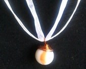 Swirled white and orange Marble on a white ribbon Necklace